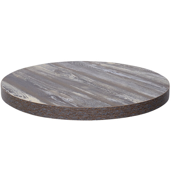 A BFM Seating Relic round wood table top with a gray and white finish.