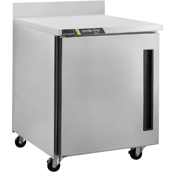 A Traulsen stainless steel worktop refrigerator with a right hinged door on wheels.