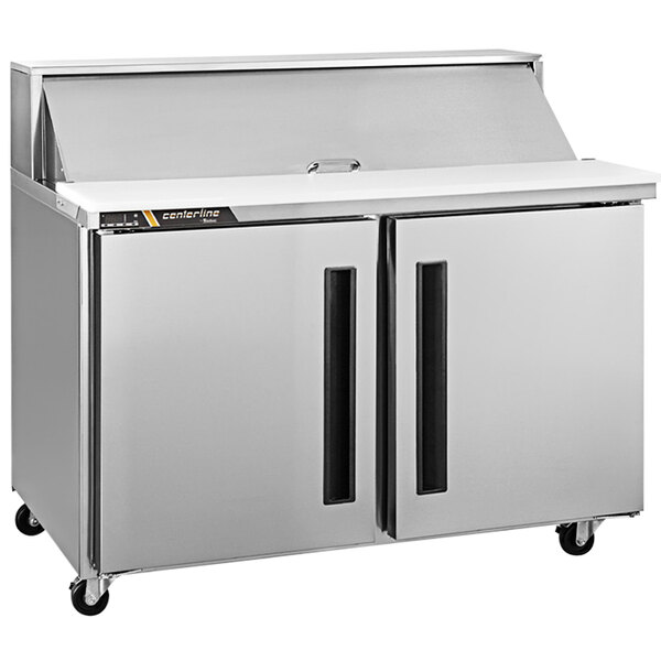 A silver Traulsen refrigerated counter with two doors.