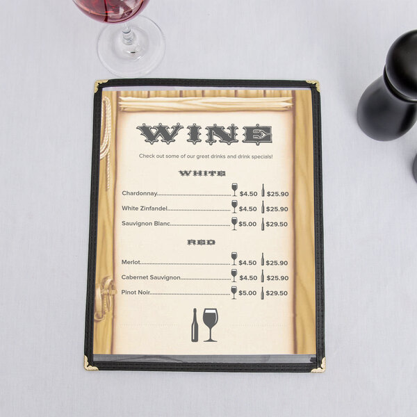 The left insert of a menu holder with a Southwest themed saloon design on a table with a wine glass and bottle.
