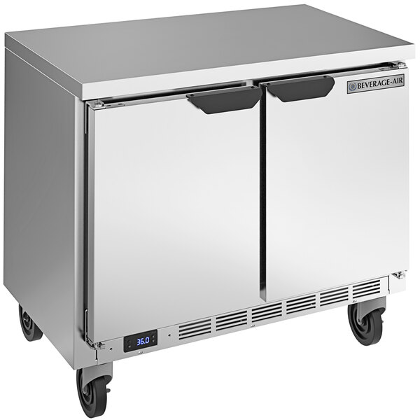 A silver stainless steel Beverage-Air worktop refrigerator with two doors on wheels.