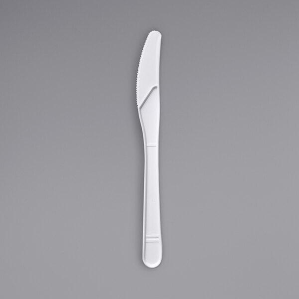 A Fineline Conserveware white plastic knife.