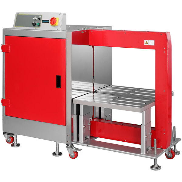 A red and silver PAC Strapping automatic side seal strapping machine with a red door.