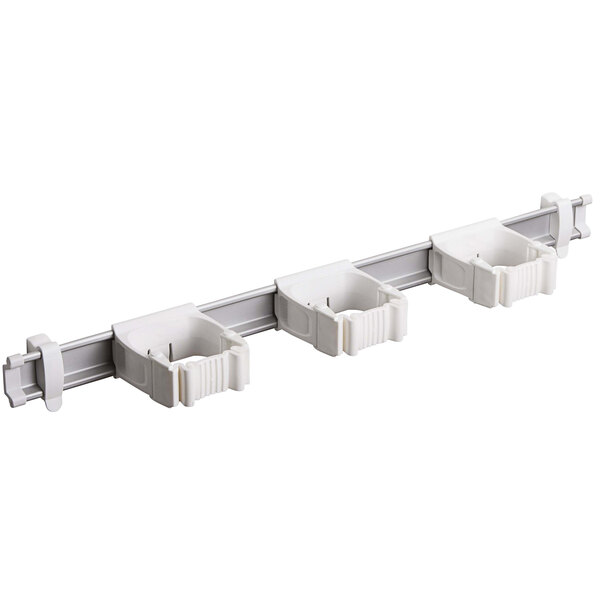 A white Toolflex One tool organizer with three white plastic tool holders.