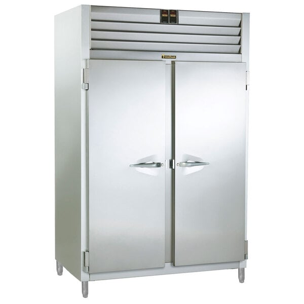A stainless steel Traulsen two section reach in holding cabinet with two doors.