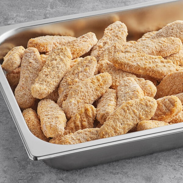 A tray of Beyond Meat breaded chicken tenders on a table.