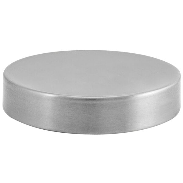 A Room360 stainless steel round plate with a white background.