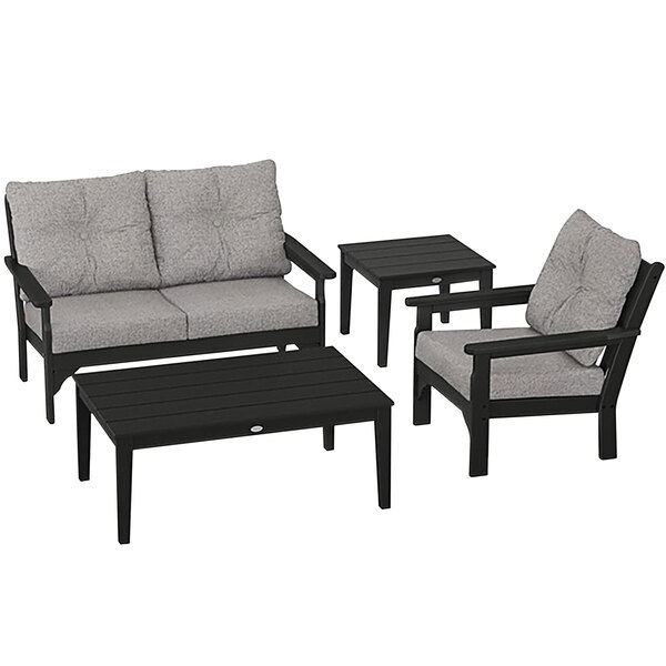 A black and grey POLYWOOD outdoor furniture set with chairs and tables.