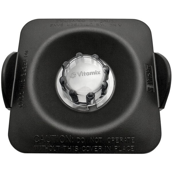 A black square Vitamix lid with a clear circular center.
