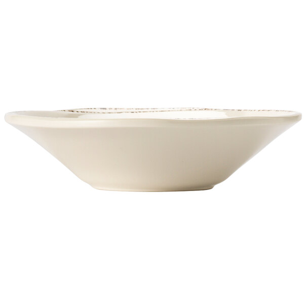 A Libbey ivory melamine bowl with a gold rim.