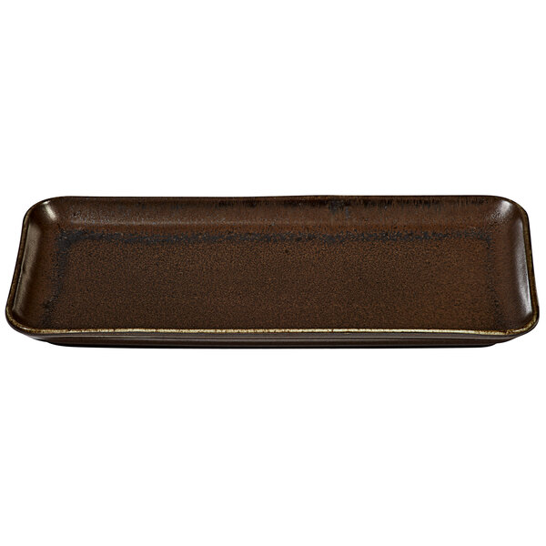 A rectangular white porcelain platter with a brown speckled finish.
