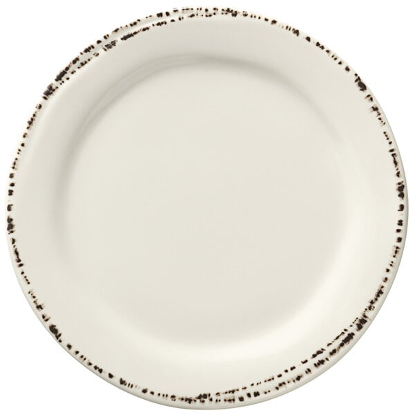 A Libbey ivory melamine plate with brown speckled edges.