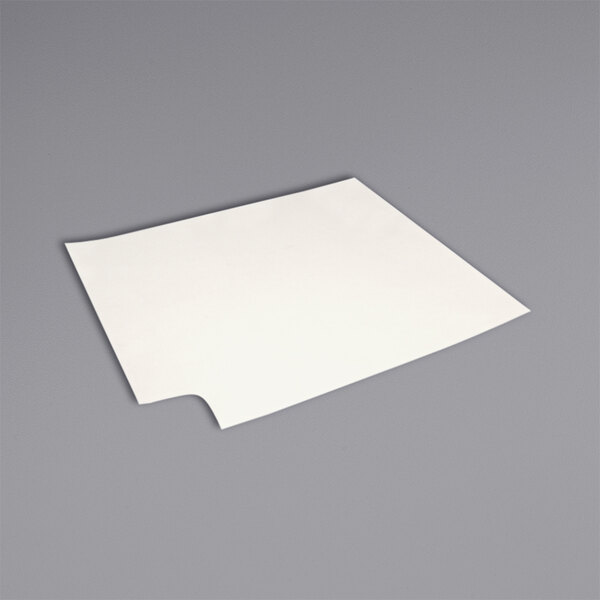A white square Vito Fryfilter filter pad on a gray surface.