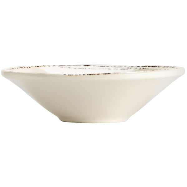 A Libbey ivory melamine bowl with a brown rim.