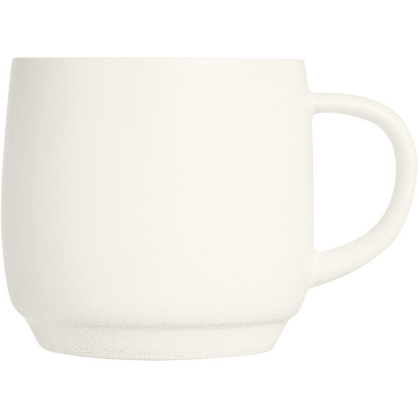 An ivory Arcoroc espresso cup with a handle.
