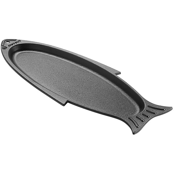 An Outset black cast iron fish shaped pan.