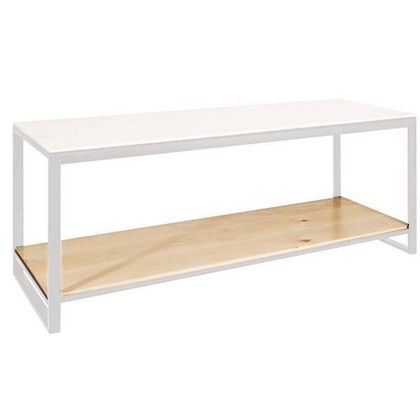 A Cal-Mil maple bottom shelf on a white table.