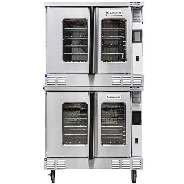 A large stainless steel Garland double deck oven with two doors.