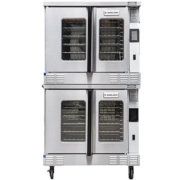 A large stainless steel Garland double deck convection oven with two doors.
