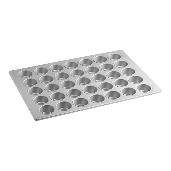 A large aluminized steel muffin or cupcake pan with 35 cups, designed for baking multiple items at once.