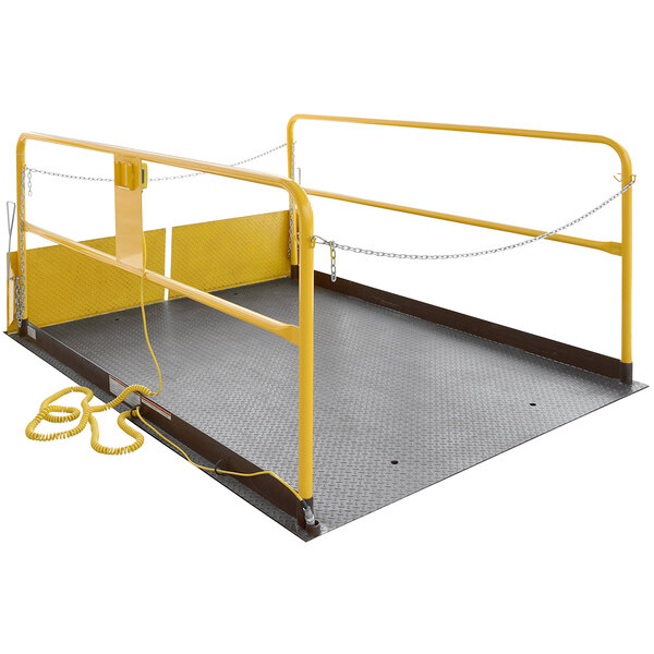 A yellow metal and metal Vestil truck scissor dock lift platform with chain.
