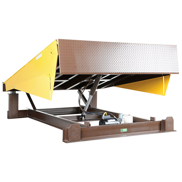 A yellow and brown Vestil powered hydraulic dock leveler with a metal platform and yellow cover.
