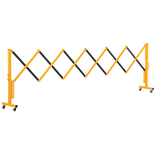 A yellow and black metal safety barrier with wheels.
