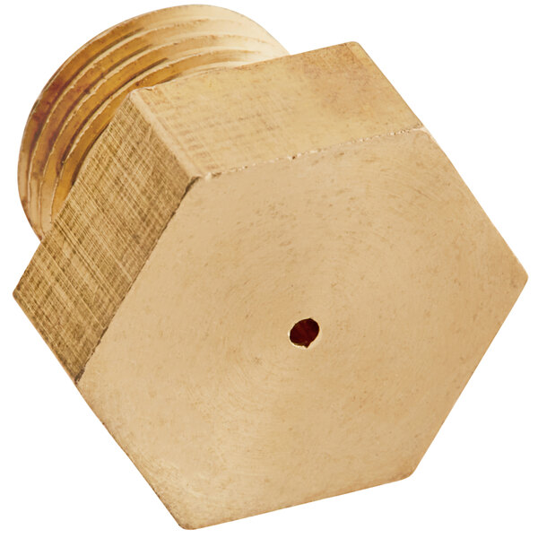 A brass hexagonal orifice with a hole in the middle.