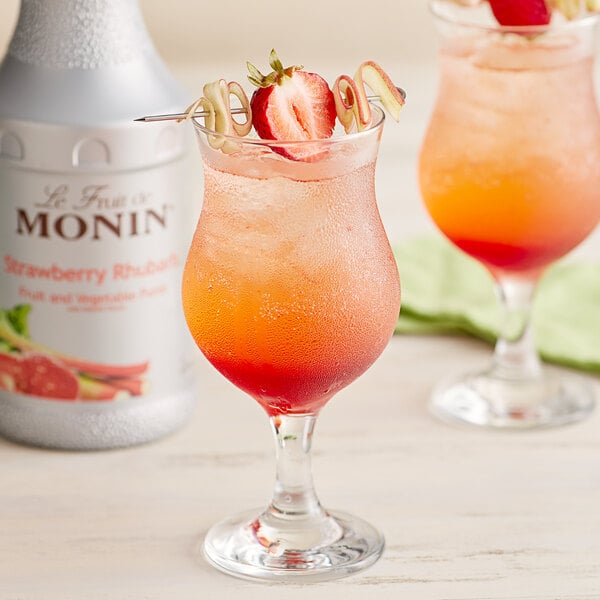 Two glasses of strawberry and rhubarb drinks made with Monin puree.
