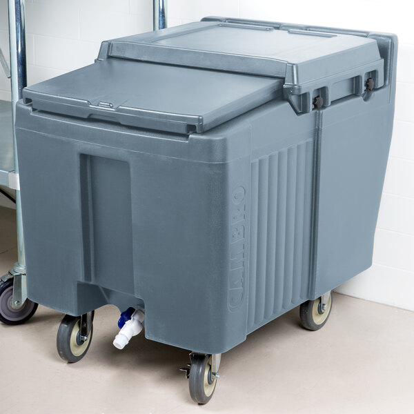 A large grey plastic container on wheels with a sliding lid.