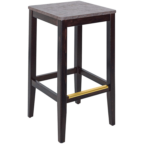 A dark walnut beechwood backless bar stool with a square top and a copper seat.