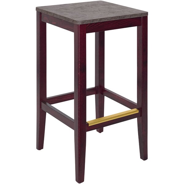 A BFM Seating dark mahogany wood barstool with a square top and a copper seat.