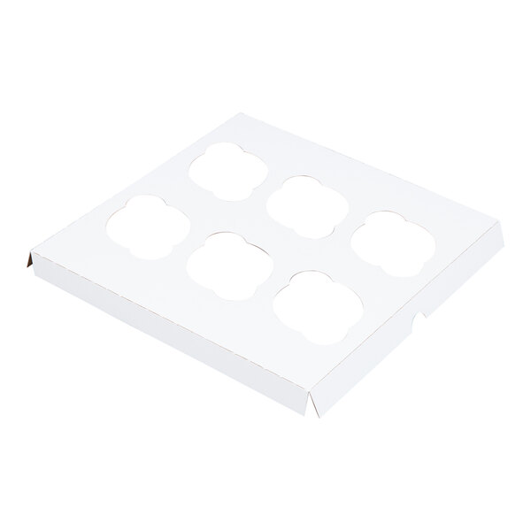 A white cardboard cupcake box insert with six slots for holding cupcakes.