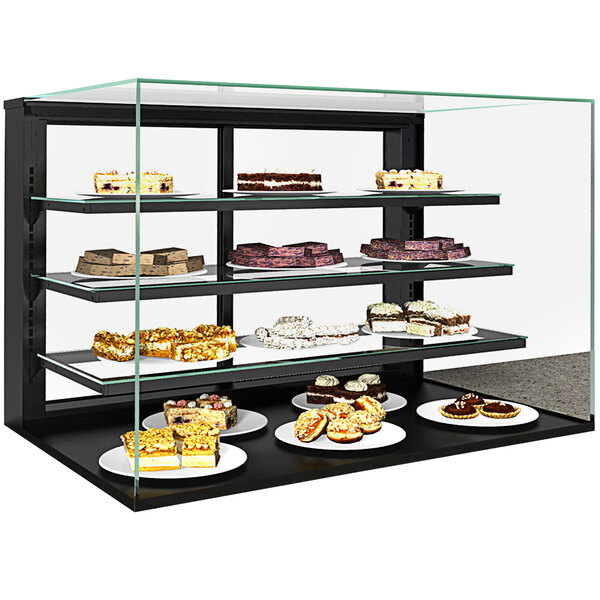 A Structural Concepts countertop bakery display case with cakes and pastries on shelves.