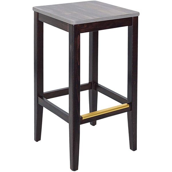 A dark walnut beechwood square backless barstool with a relic chestnut seat.