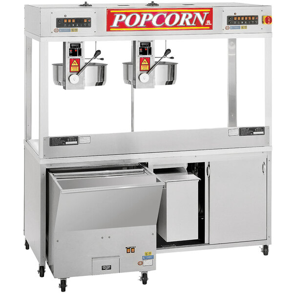 A Cretors popcorn machine with two kettles and a Roc N' Roll warmer tray.