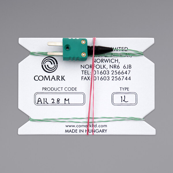 A white card with a green plug attached to a Comark Type-K flexible wire air probe.