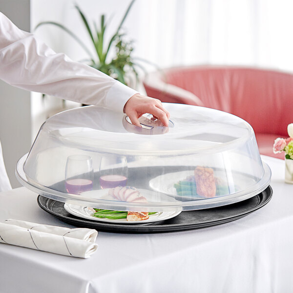 An American Metalcraft oval tray cover on a tray with food on it.