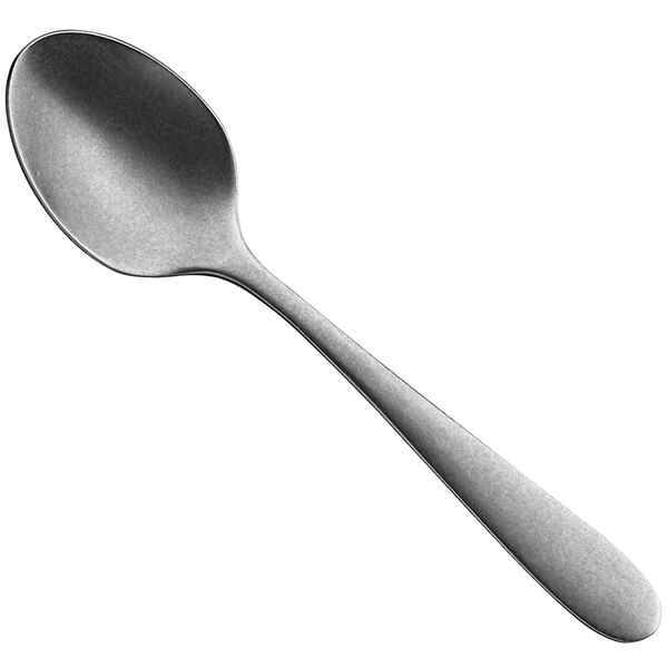 A close-up of a WMF Sara Stonewash stainless steel demitasse spoon with a silver handle.