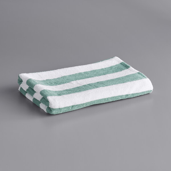 A white and green striped Oxford Classic pool towel.