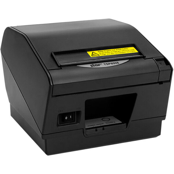 A gray Star TSP847IIU thermal receipt printer on a counter with a yellow label.