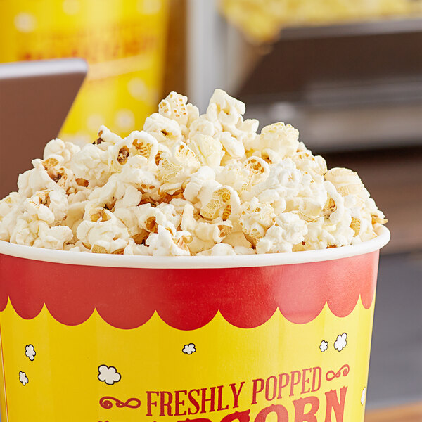 A white bucket of Pop Weaver Caramel & Sweet Mushroom Popcorn kernels.