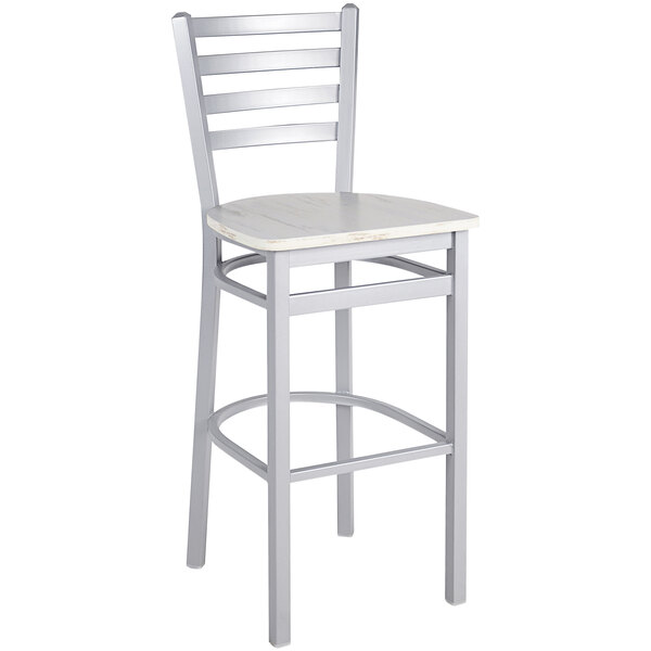A silver metal BFM Seating ladder back barstool with a wooden seat.