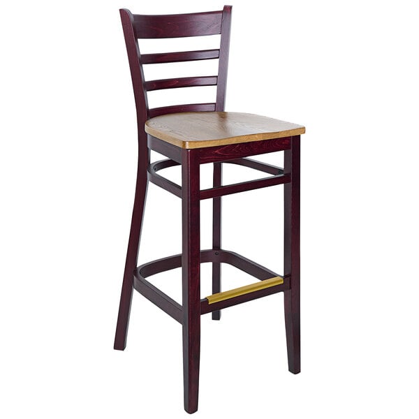 A BFM Seating dark mahogany wooden ladder back barstool with a wooden seat.