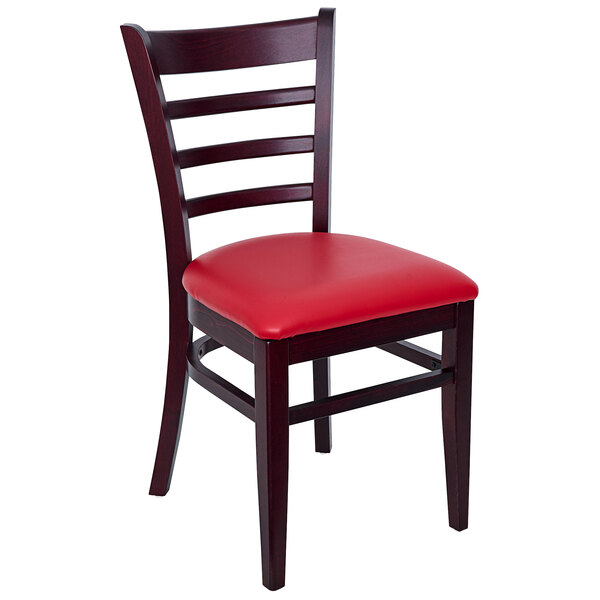 A BFM Seating Berkeley beechwood restaurant chair with red vinyl seat and ladder back.