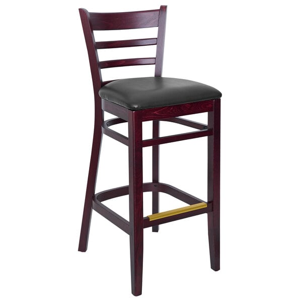 A BFM Seating Berkeley beechwood barstool with black vinyl seat and back.