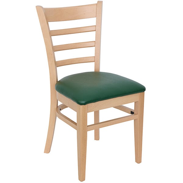 A BFM Seating wooden restaurant chair with a green vinyl cushion.
