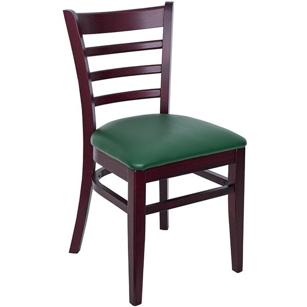 A BFM Seating wooden ladder back chair with a green vinyl seat.