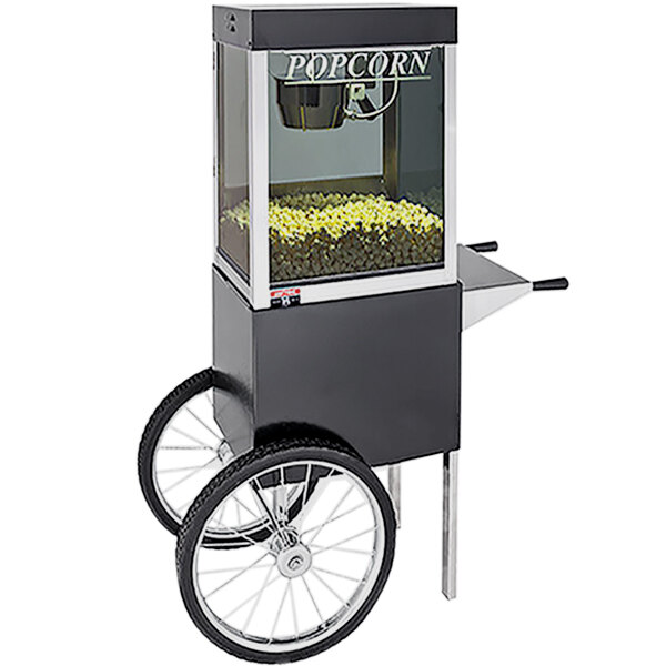 A Cretors black two-wheel wagon for a popcorn machine.