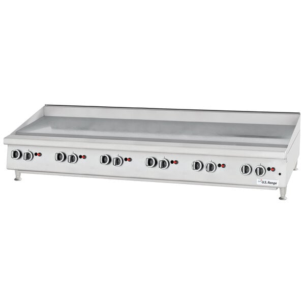 A large white Garland countertop griddle with manual controls.